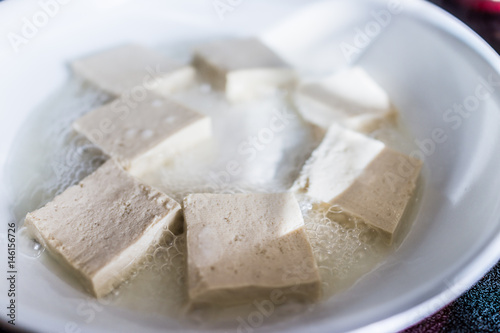 Tofu frying in ceramic pan