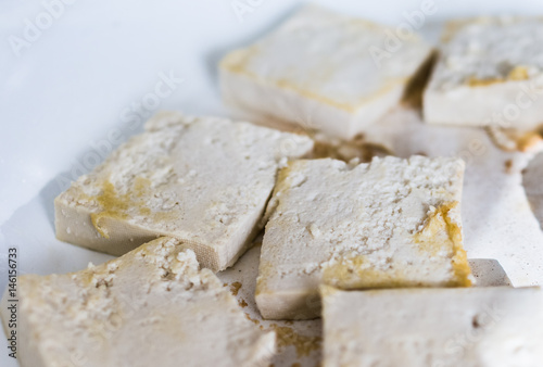 Tofu frying in ceramic pan