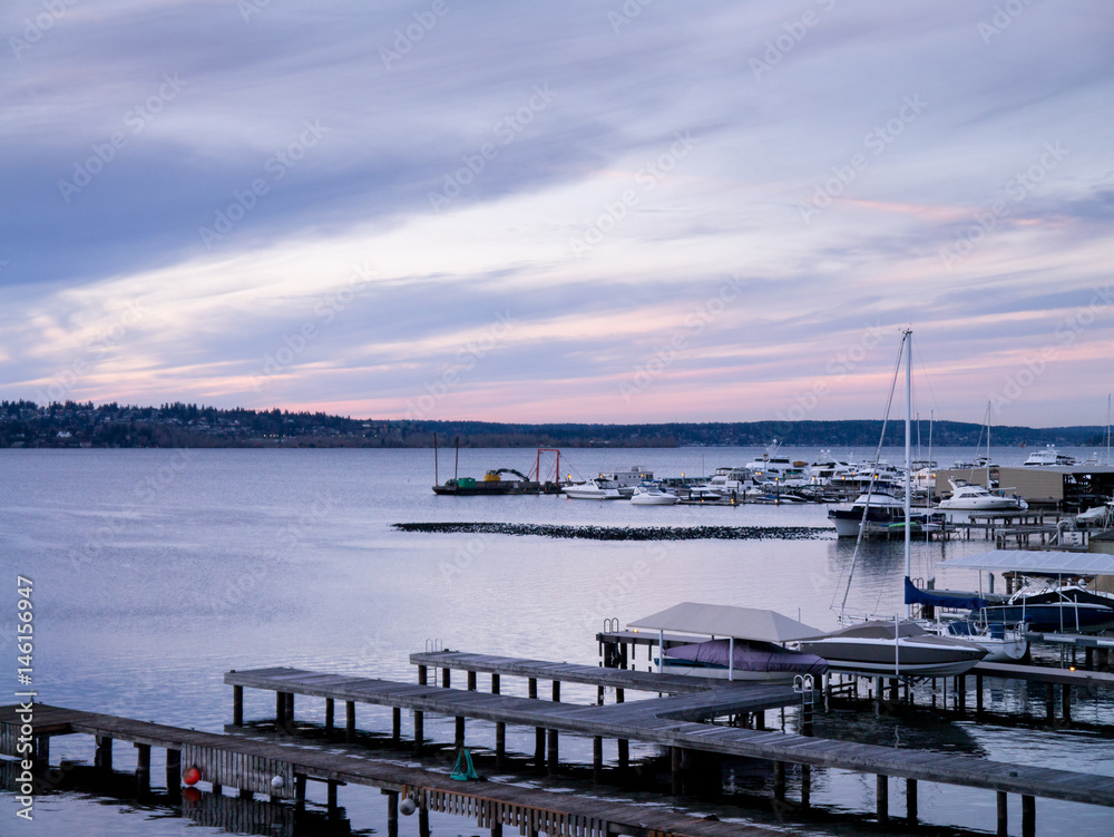Sunset at a marina, docks and boats; copy space