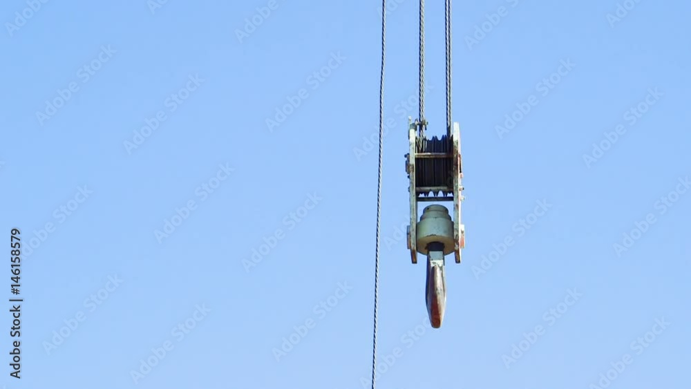 Not loaded hook of construction crane on the boom Not loaded hook of construction crane on the boom