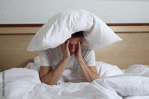 Sleep Disorders and Problems. Man struggling with insomnia. photo