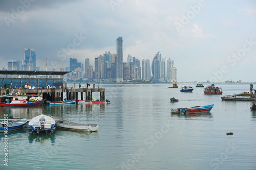 Panama city fishing harbor wharf and boats with skyscrapers buildings in background, Pacific coast of Panama, Central America © dam