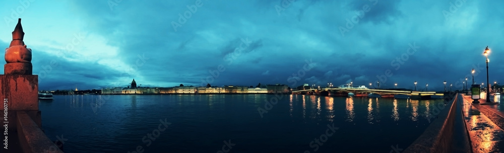 View of St. Petersburg and the Neva River, Russia. St. Isaac's Cathedral, the Golden Dome, the Admiralty, the Palace Bridge, the reflection of water.