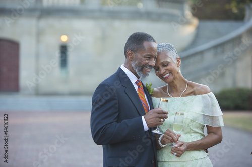Black couple drinking champagne photo