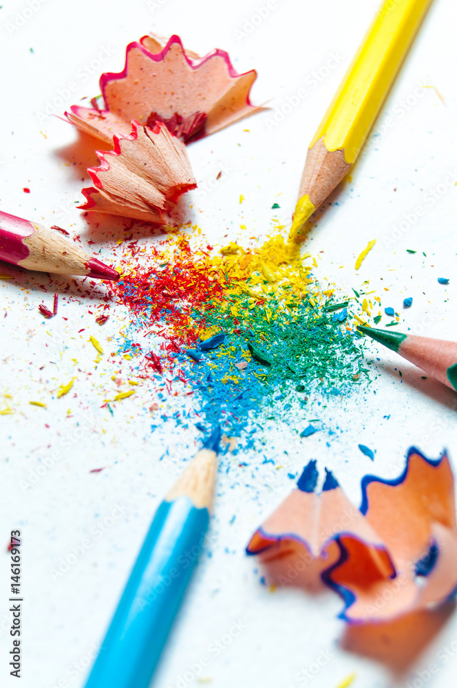 Many different colored pencils on paper background. Many different colored pencils on paper background.