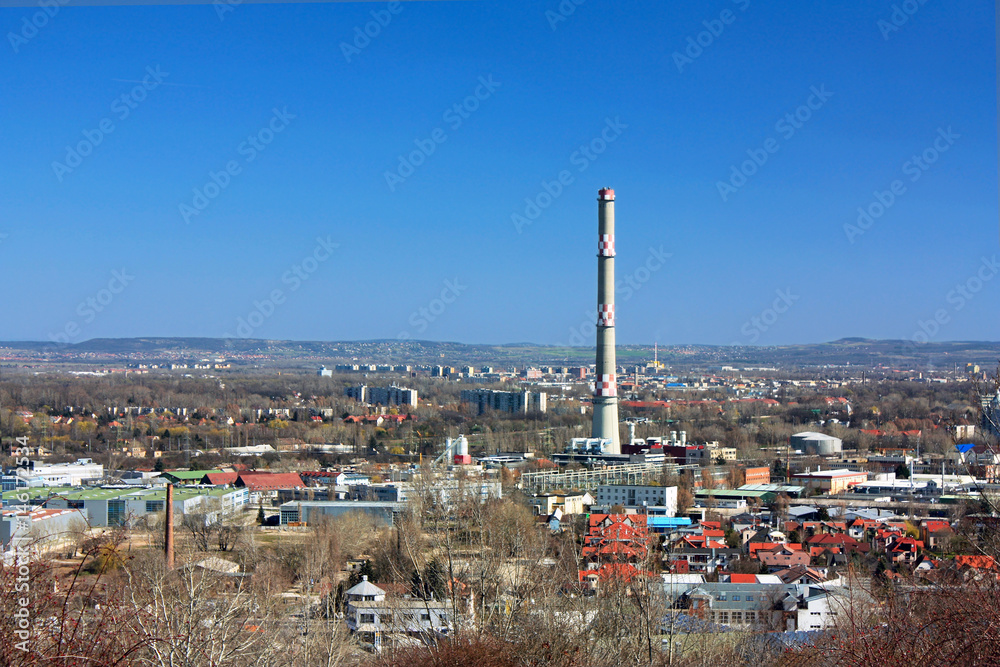 Chimney industrial area with houses and blue sky