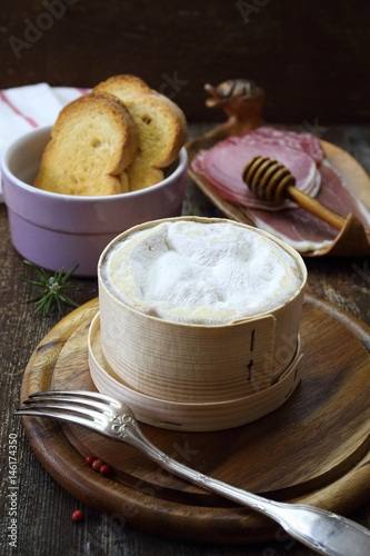 French Vacherin Mont d'Or cheese, cold cuts for fondue