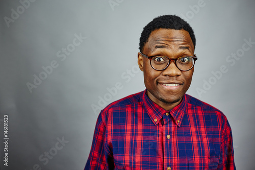 attractive young black male studio flannel silly smile