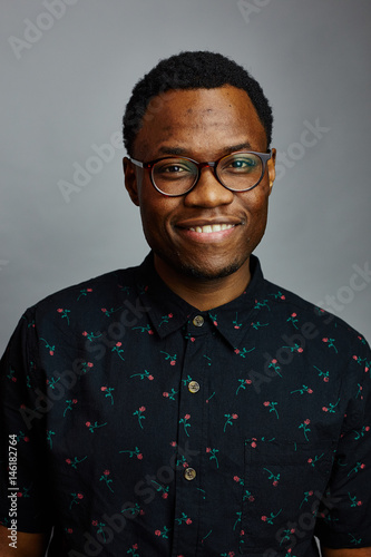 attractive young black male studio smile