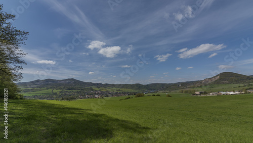 Green view of Ceske Stredohori mountains over Libochovany village