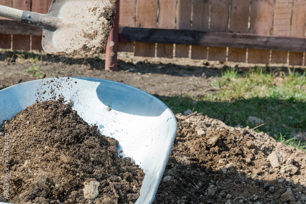 Garden wheelbarrow with the earth. Garden wheelbarrow with the earth.