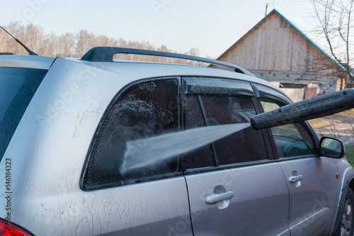 To wash the car with the high-pressure apparatus. © Sergey_Siberia88