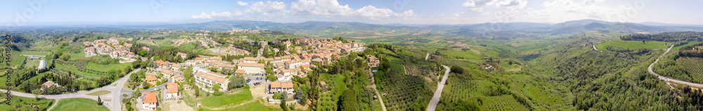 Tuscany countryside and medieval town on the hill. Amazing panoramic aerial view