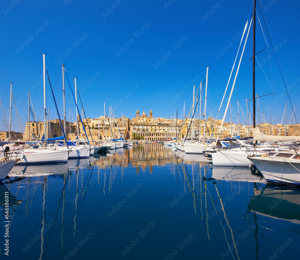Sailing boats on Senglea marina in Grand Bay, Valetta, Malta