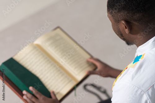 African Muslim Man Reading Holy Islamic Book Koran