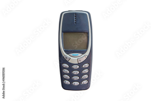 Old cellular mobile phone isolated on white background