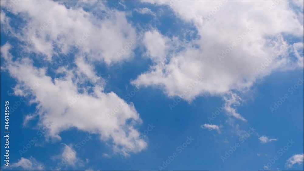 White clouds move across clear blue sky. Cloudy blue sky background. White clouds move across clear blue sky. Cloudy blue sky background.