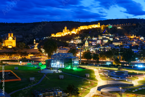 View of Rike Park Old city, Metekhi bridge and church and Narikala fortress at night. Tbilisi, Georgia