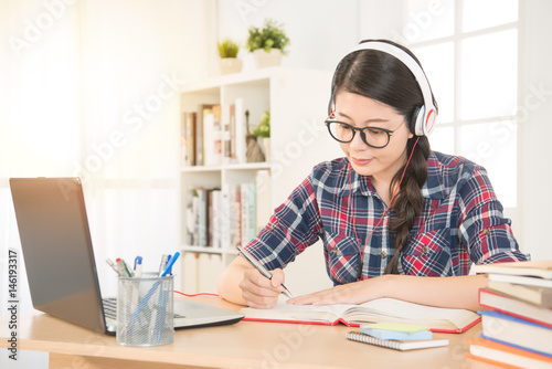 student learning on line with headphones