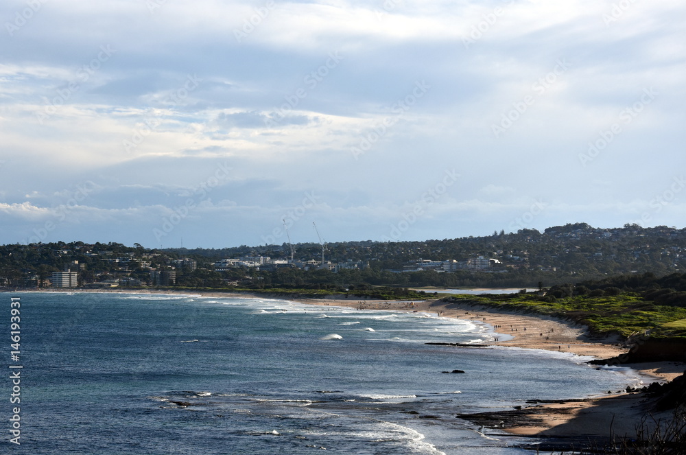 Panoramic view of Dee Why beach on a sunny day from Long Reef Headland (Sydney, NSW, Australia). A great place to relax as the beach is mainly frequented by locals.