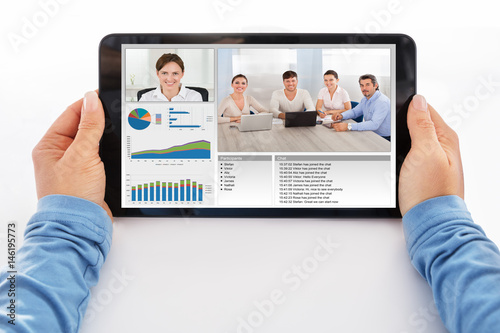 Businesswoman Attending Video Conference On Digital Tablet