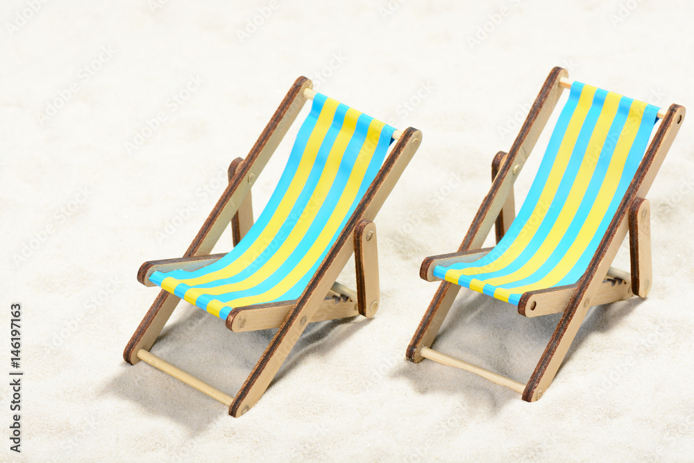 Two sunbeds on the beach: top view Two sunbeds on the beach: top view