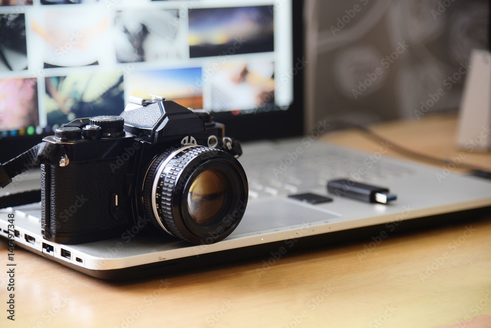 Digital Studio Photography Workstation. Retro film DSLR Camera, Laptop Computer Screen and flash drive memory card