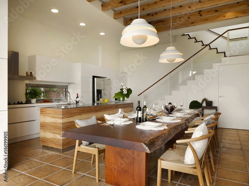 Large wooden dining table in kitchen photo