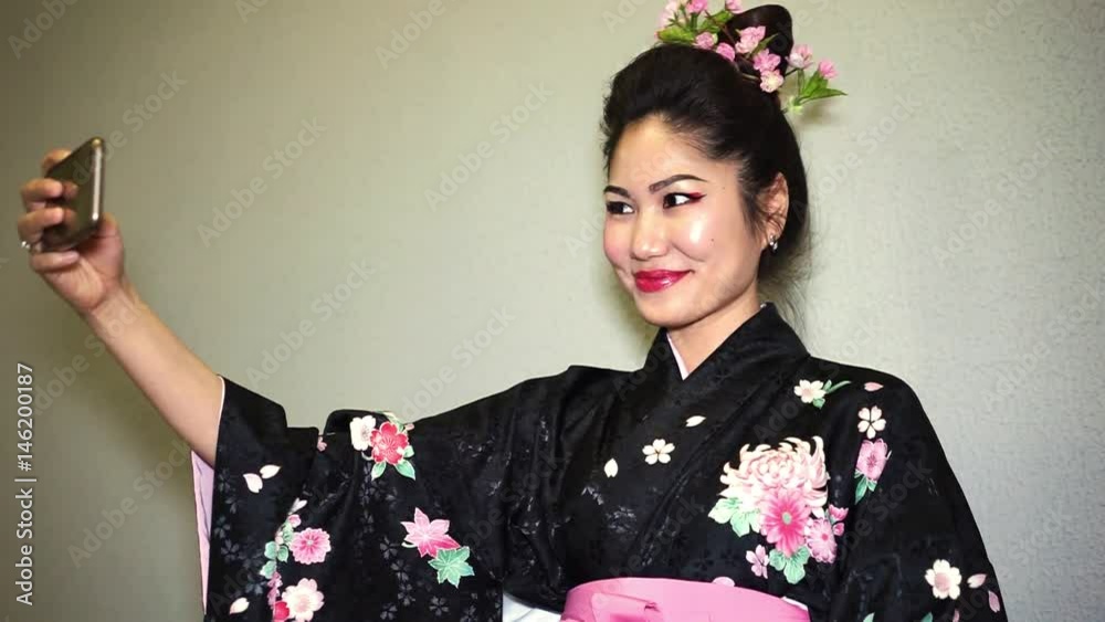 beautiful geisha in traditional japanese kimono making selfie beautiful geisha in traditional japanese kimono making selfie