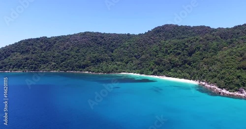 Panning aerial footage of Blue Lagoon beach Perhentian Island Malaysia