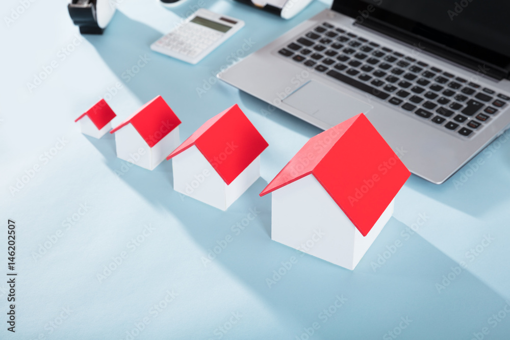 Different Size House Models On Desk Different Size House Models On Desk