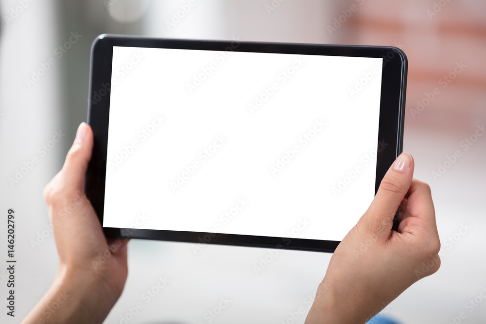 Woman Looking At Digital Tablet