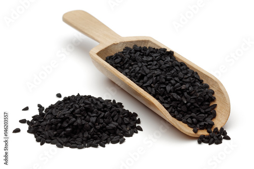 nigella seeds in wooden scoop