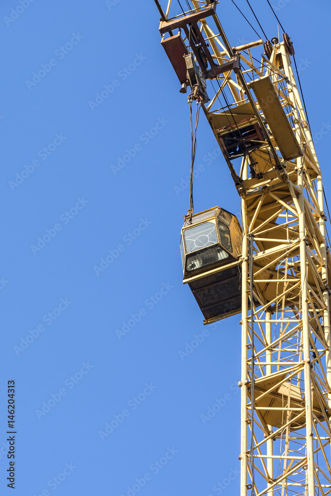 Tower crane against blue sky. Tower crane against blue sky.