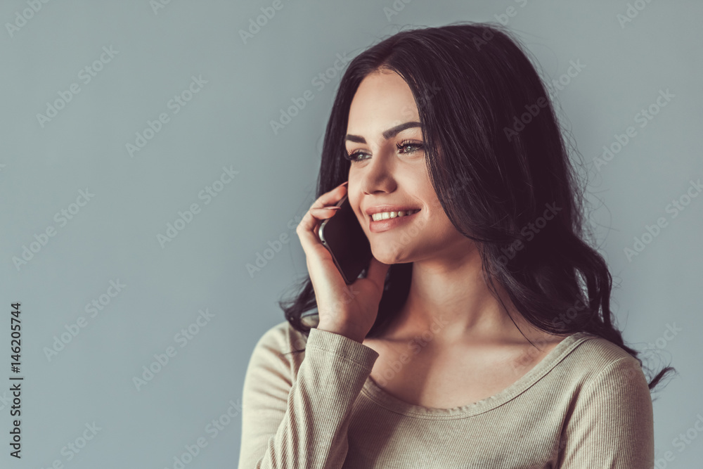 Beautiful young woman with gadget Beautiful young woman with gadget