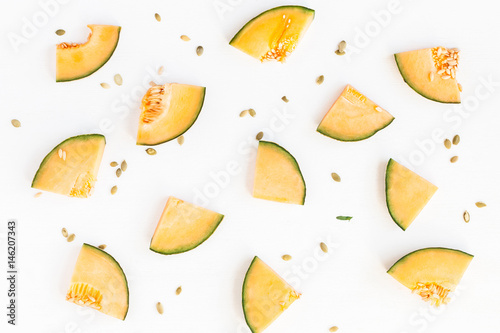Sliced melon on white background. Flat lay, top view