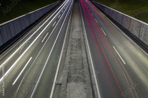 Car trail laights on a highway