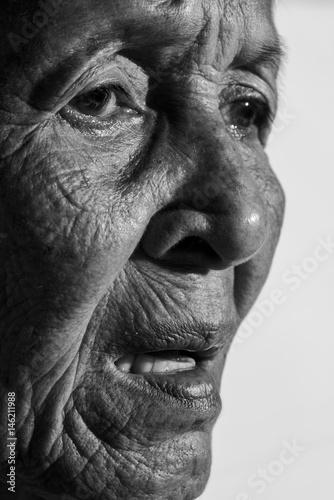 Lonely senior woman 
portrait sad depressed,emotion, feelings, thoughtful, senior, old woman,wait, gloomy, worried, covering her face, Human face expressions,
isolated black background