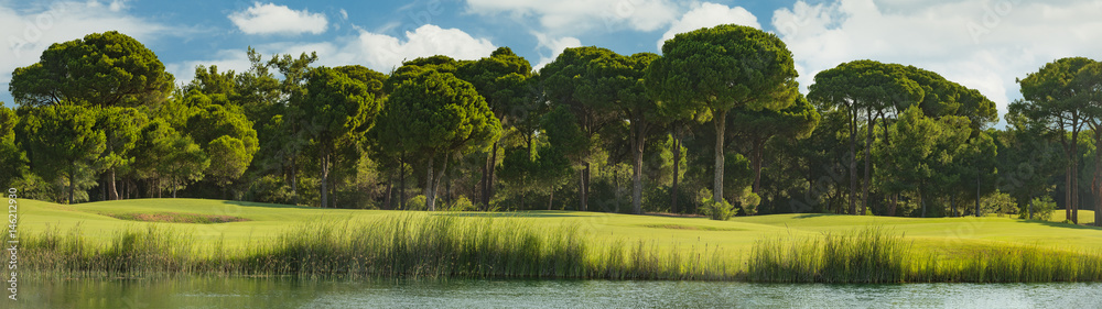 Fototapeta premium Golf course with lake and trees in belek Turkey