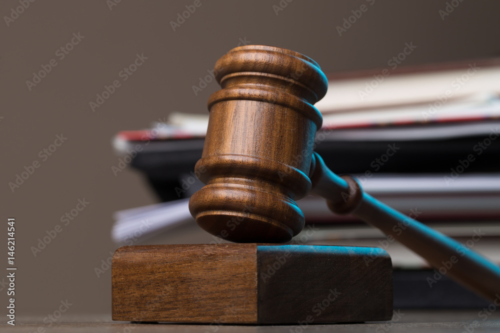 Hammer, documents lying on table Hammer, documents lying on table
