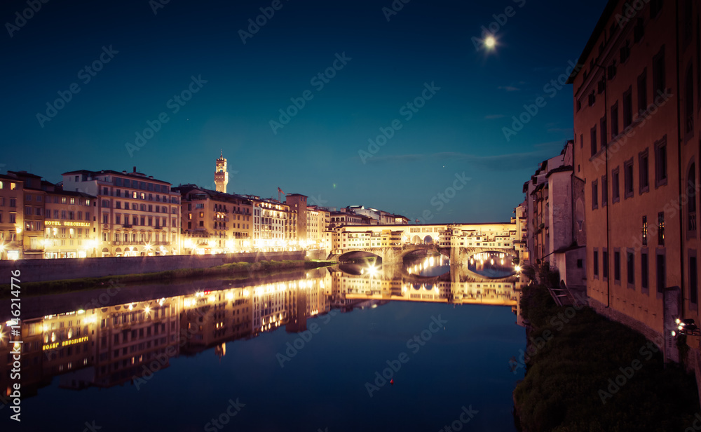 Fototapeta premium travel amazing Italy series - Ponte Vecchio and River Arno at Night, Florence, Tuscany