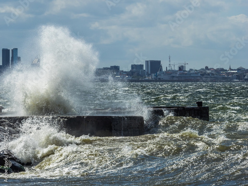 Crashing waves with Tallinn downtown in background