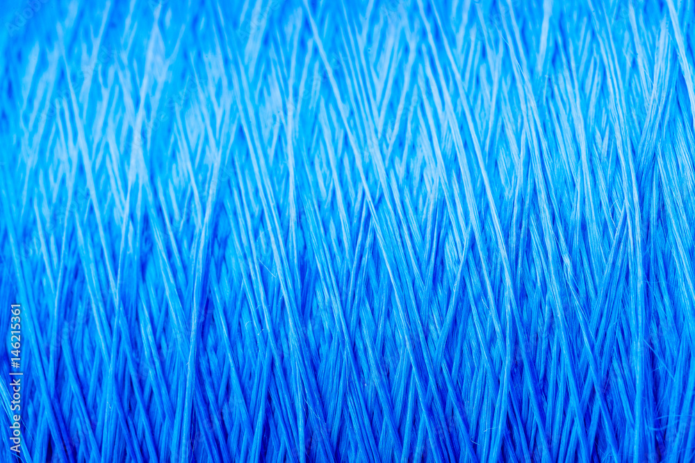 reel blue silk thread. textile concept. abstract background reel blue silk thread. textile concept. abstract background