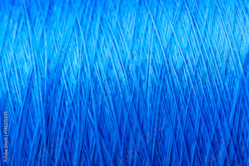 reel blue silk thread. textile concept. abstract background