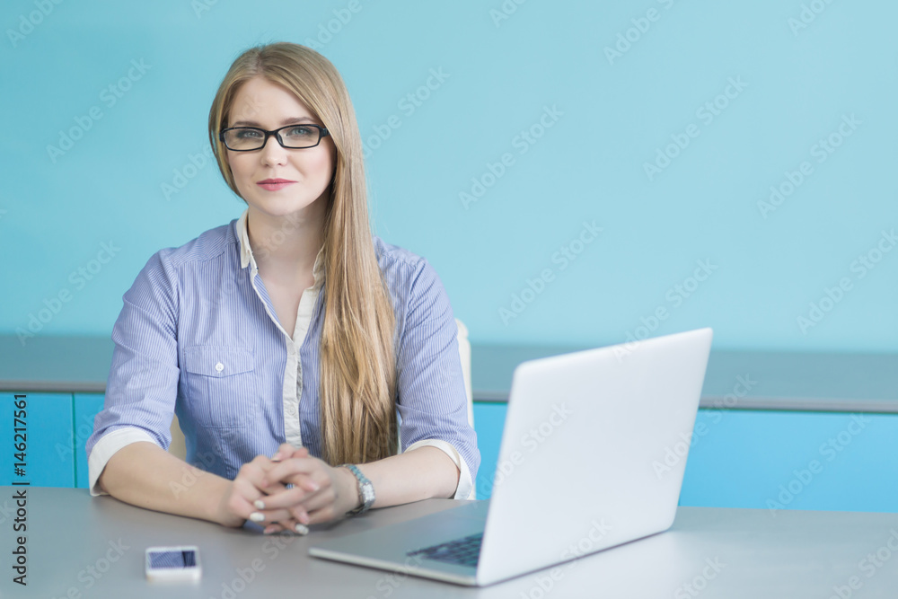 Portrait of a businesswoman working at office reading a letter in a desktop Portrait of a businesswoman working at office reading a letter in a desktop
