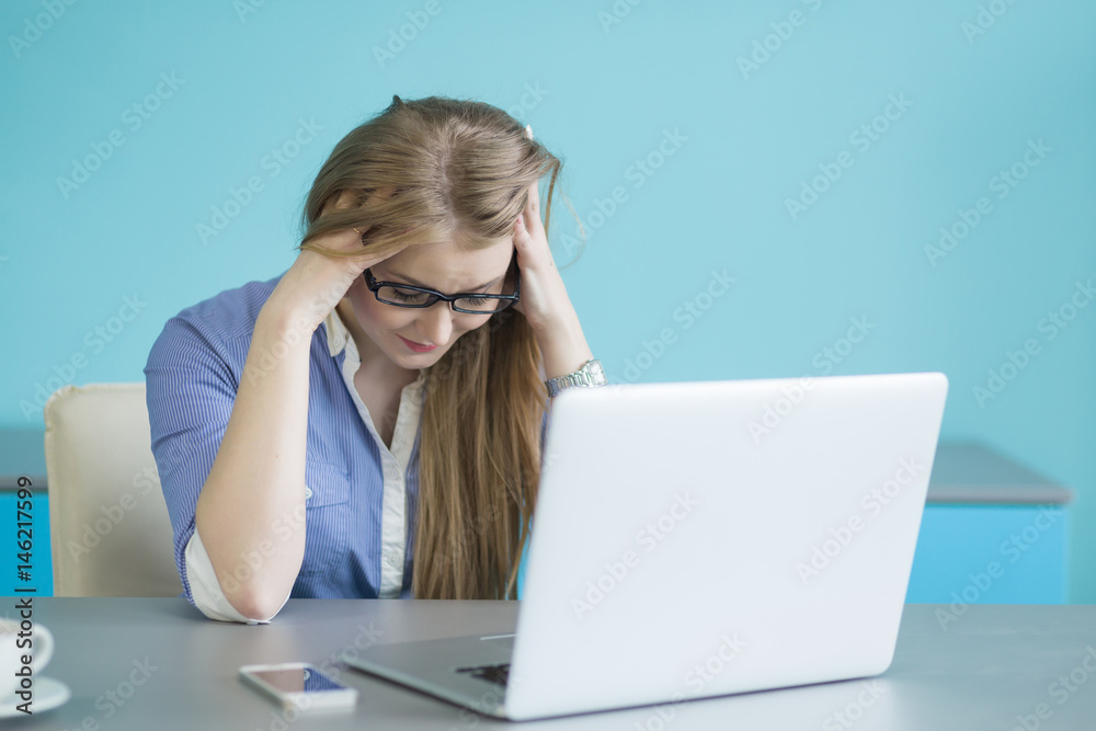 Young business man with problems and stress in the office Young business man with problems and stress in the office
