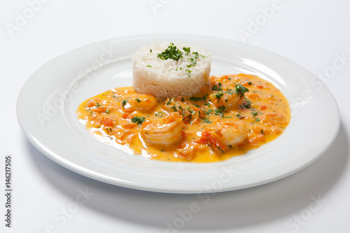 souse shrimp with greens and rice on a white background photo