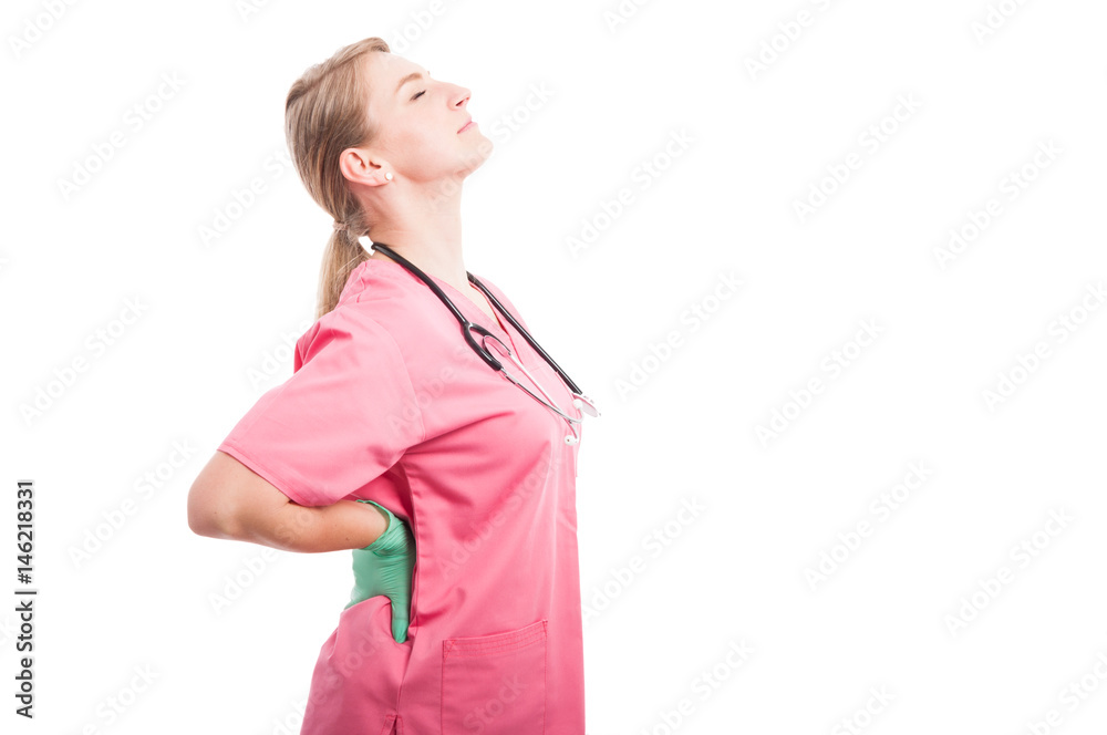 Female medical nurse holding her back like hurting Female medical nurse holding her back like hurting