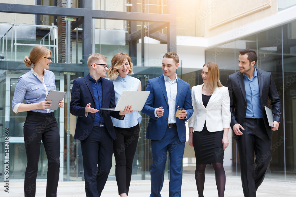 Fototapeta premium business team, businesspeople group walking at modern bright office interior