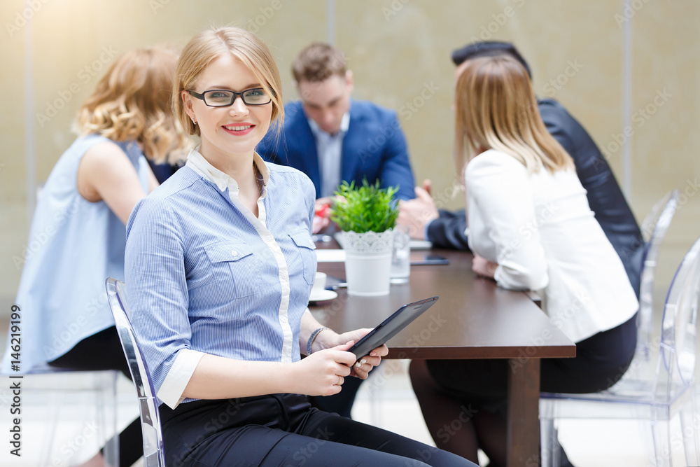 Fototapeta premium Face of beautiful woman on the background of business people